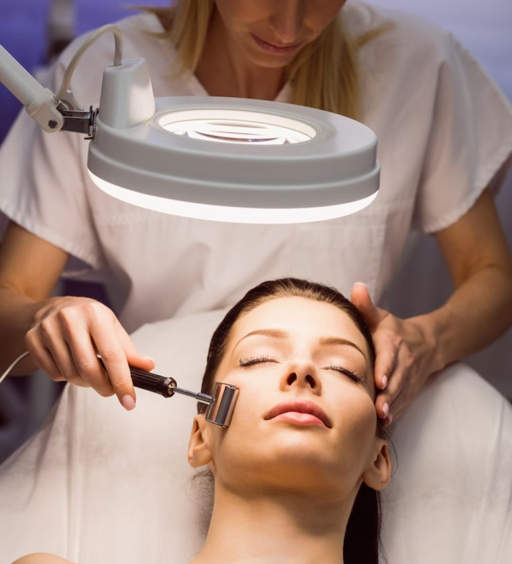 dermatologist-performing-laser-hair-removal-patient_107420-65637